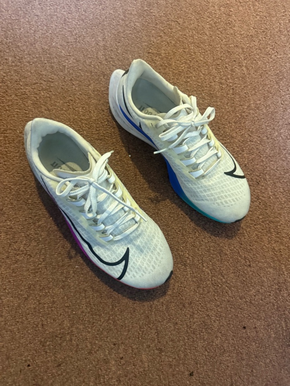 Nike White Trainers with Black Swoosh and Rainbow Midsole